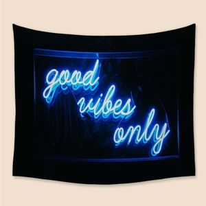Black Tapestry with Blue Letters Graphic.